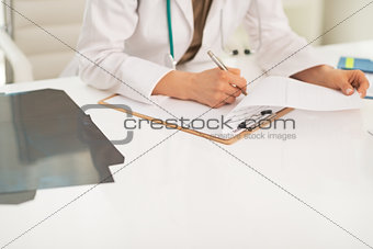 Closeup on medical doctor woman working in office