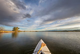 canoe with a paddle on lake