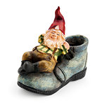 Gnome sitting on a boot isolated with clipping path