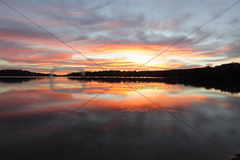 Sunrise reflections Narrabeen Lakes NSW Australia