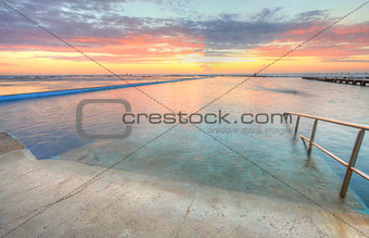 Sunrise from one of the pools to the ocean at North Narrabeen Au