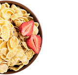 Cornflakes with strawberries on bowl