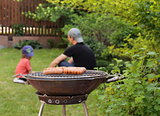 roasted sausages on a barbecue grill outdoors picnic