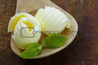fresh yellow butter served on a wooden board