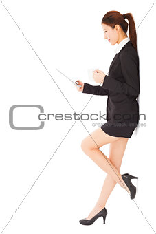  young businesswoman holding tablet and cups 