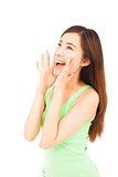 beautiful woman yelling happily isolated on a white background