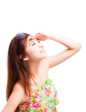 young woman raising hand to cover sunlight 