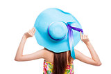 back of  girl holding a hat over white background