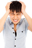 young man have a headache and feel very painful 