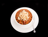Bowl of Chili Over Rice on Black Background