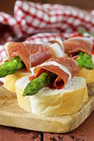 delicacy appetizer green asparagus and smoked ham