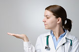 Doctor showing something on her palm