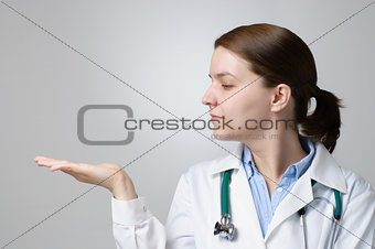 Doctor showing something on her palm