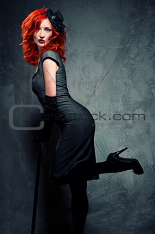 Seductive redhead woman with blood on her lips