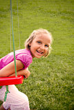 Happy girl on swing