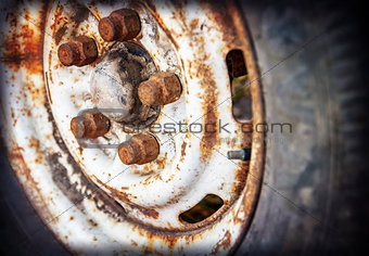 old car wheel with rusty bolts
