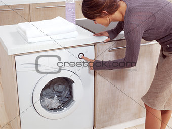 putting a cloth into washing machine