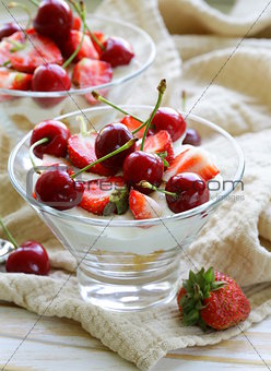 Dairy yogurt dessert with cherries and strawberries