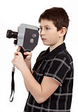 young boy with old vintage analog 8mm camera