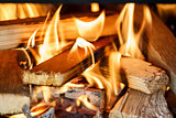 firewood burning in fireplace