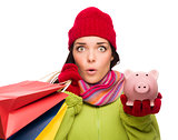 Concerned Mixed Race Woman Holding Shopping Bags and Piggybank