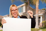 Excited Woman Holding House Keys and Blank Real Estate Sign