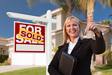 Female Real Estate Agent Handing Over the House Keys