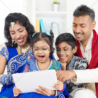 Indian family using digital computer tablet