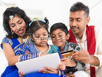 Indian Asian family online shopping with credit card