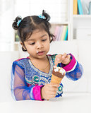 Little girl eating ice cream. 