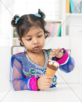 Little girl eating ice cream. 