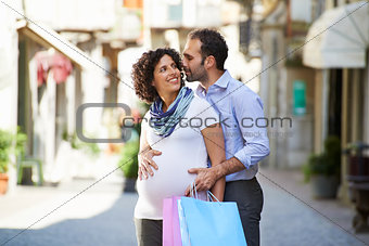 pregnant woman and man shopping in Italy