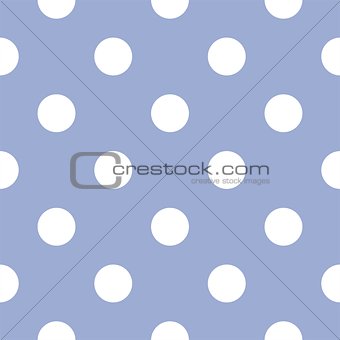 Seamless pattern or tile vector background with white polka dots on a pastel blue background.