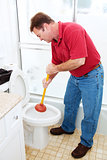 Man Plunging Toilet