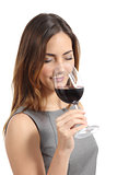 Beautiful sommelier woman tasting wine