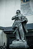 statue with book near Latin Cathedral