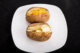 Two Baked Potatoes on White Plate