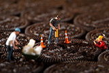 Construction Workers in Conceptual Imagery With Cookies