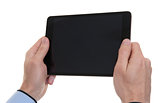 male hands holding a tablet touch computer gadget
