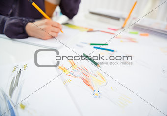 Closeup on fashion designer making sketches