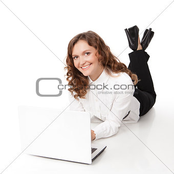 Woman with laptop lying down on the floor