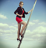 business woman on ladder 