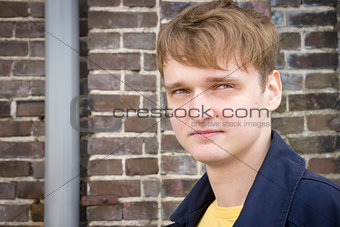 Portrait of a handsome young man against urban background