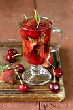 summer fruit tea with a variety of berries (cherry, strawberry)