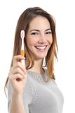 Woman portrait with a perfect white smile holding a toothbrush