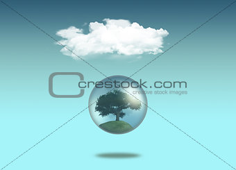 Tree in globe under a white cloud