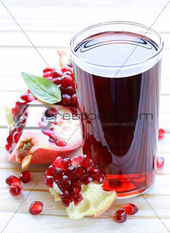 glass of fresh pomegranate juice from organic fruits