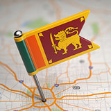 Sri Lanka Small Flag on a Map Background.