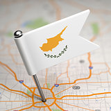 Cyprus Small Flag on a Map Background.