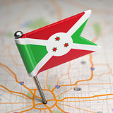 Burundi Small Flag on a Map Background.